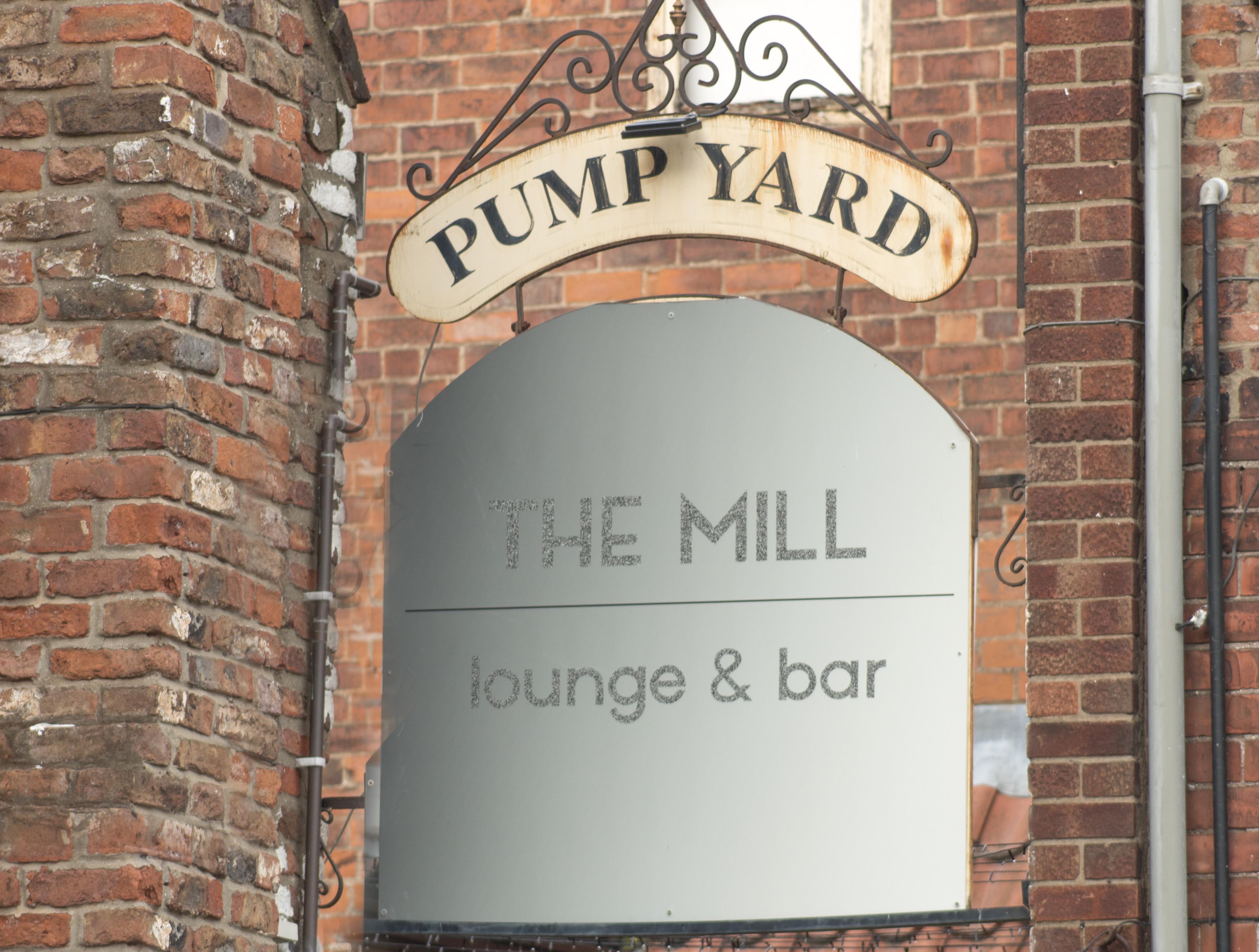 the mill pump yard sign