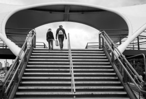Photo of Murdoch Connection bridge steps in black and white with two people.
