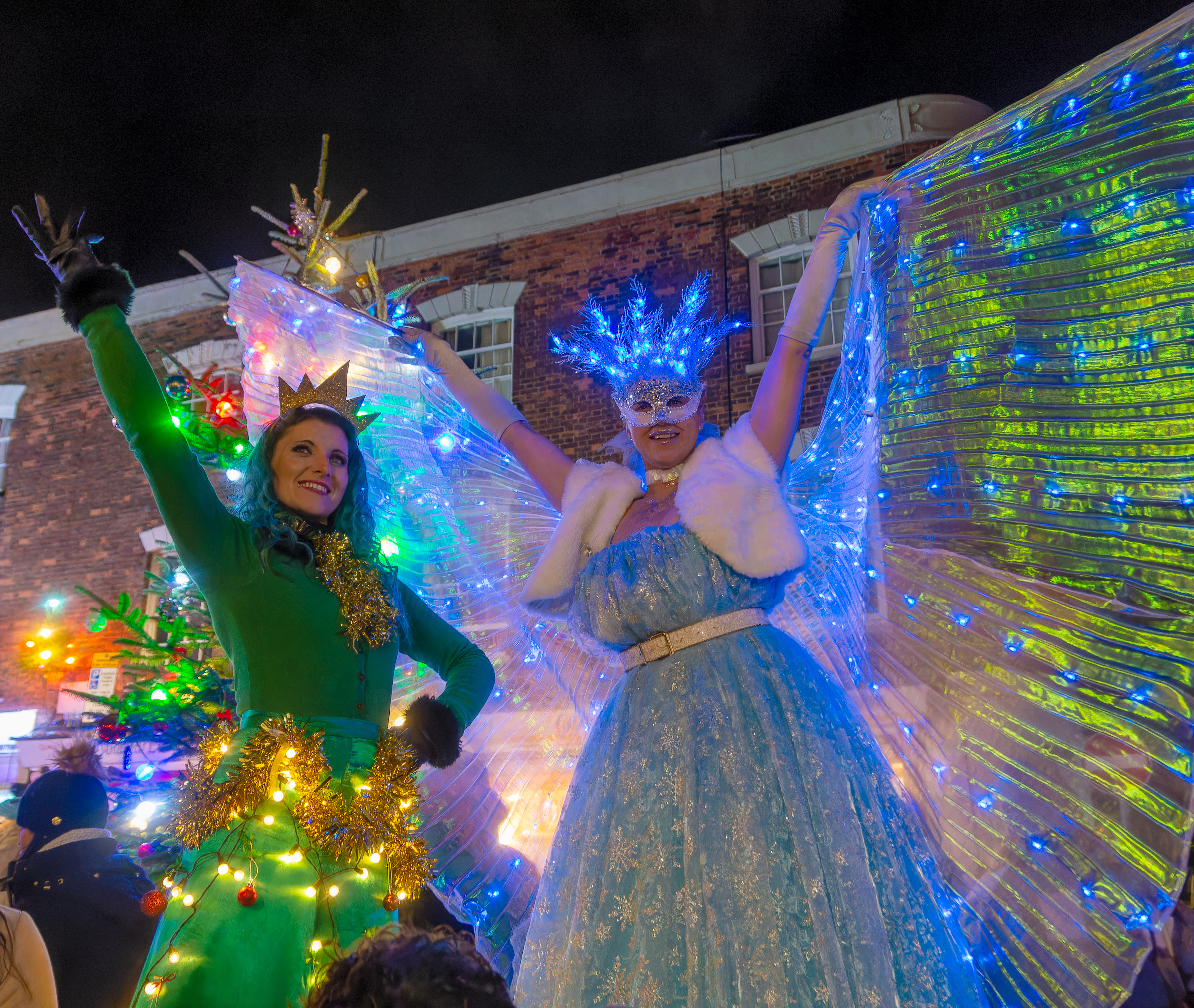 Stilt walkers lit up