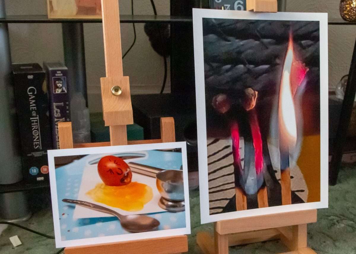 Two photographs are on easels ready for study